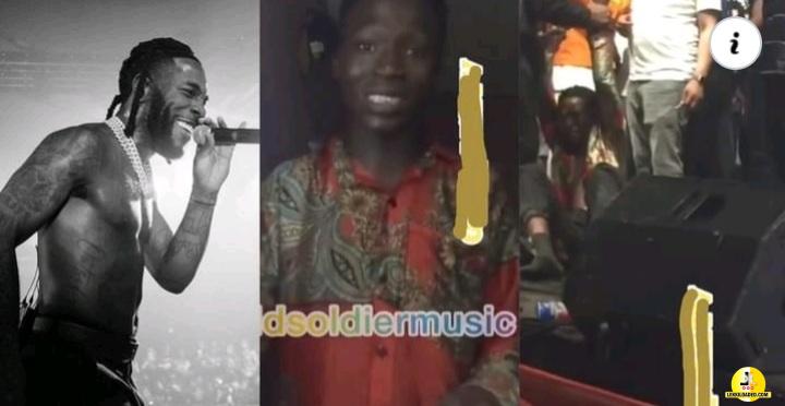 Fan pushed off stage by Burna Boy vows to wear the same shirt all through 2022