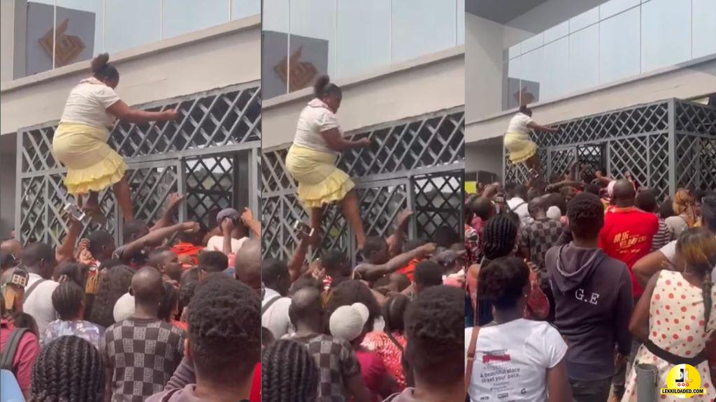 Naira Scarcity: Checkout the moment spider woman uses her talent to jump the queue and enters the banking hall (Video)