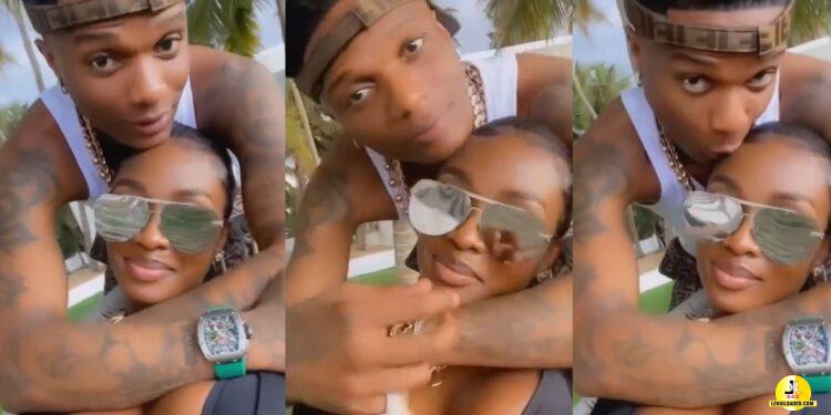 “A slap on Jada” – Netizens react to video of Wizkid all loved up with mystery lady, calling her girlfriend (Watch)
